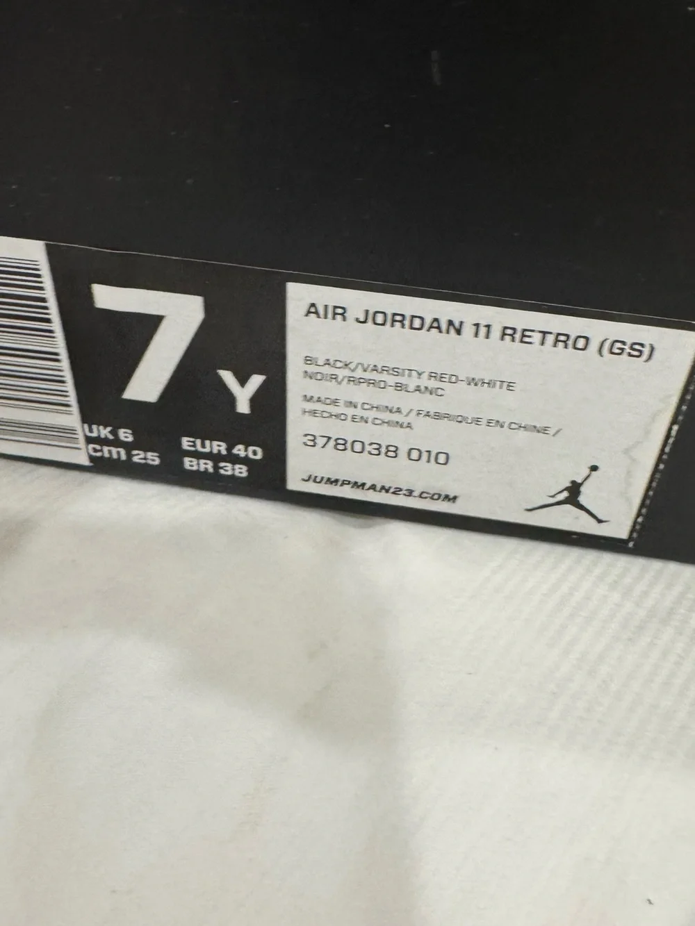 Air Jordan 11 Retro (GS) Black and Red High-Top Sneakers